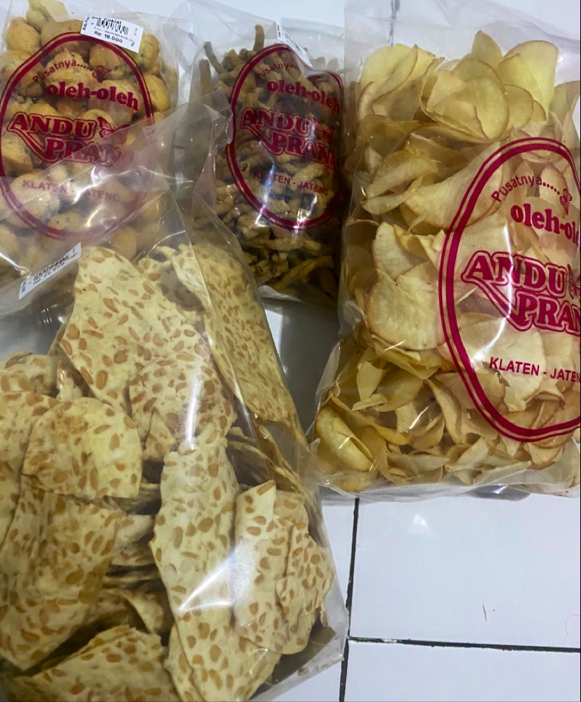 Assorted packaged snack products bearing the Andu Prana name